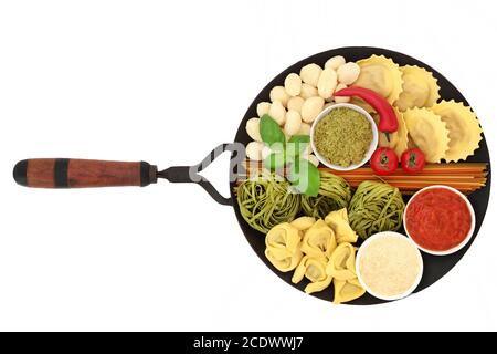 Healthy Italian pasta ingredients with tricolour linguine, gnocchi, raviolli, tortellini & spinach spaghetti with tomato sauce, pesto & parmesan. On a Stock Photo