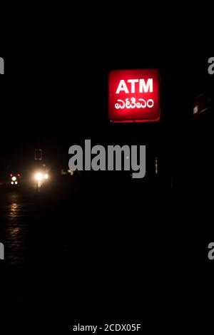 atm sign board on a dark street Stock Photo