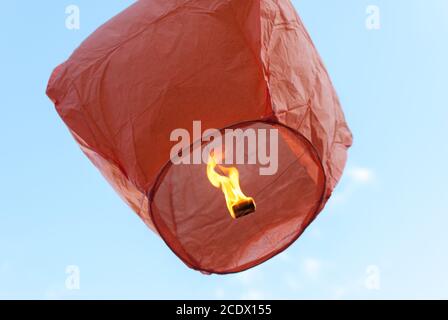 red paper lantern, flying in the sky Stock Photo