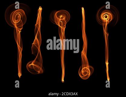 set of five abstract red orange smoke fire brushes flowers over black background Stock Photo