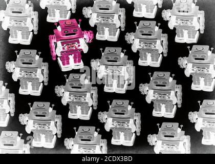 concept gong against the crowed with retro robot toys Stock Photo