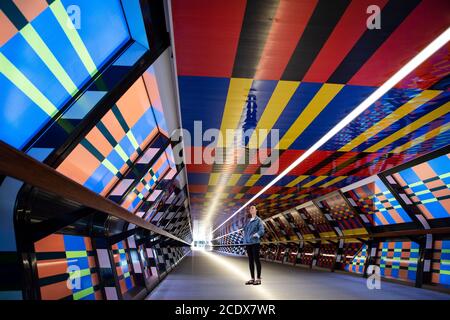 EDITORIAL USE ONLY Francesca Clemens looks at new artwork from contemporary artist Camille Walala, which reimagines the Adams Plaza Bridge in Canary Wharf, for the debut London Mural Festival. Stock Photo