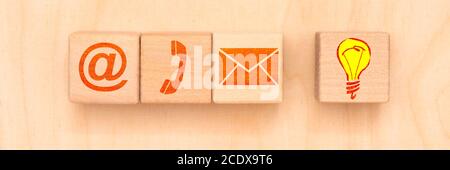 Contact for support printed on wooden cubes Stock Photo