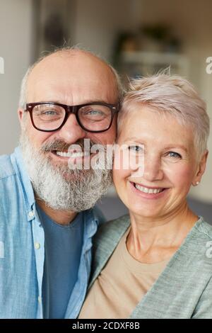 Portrait of senior happy family smiling at camera and embracing Stock Photo