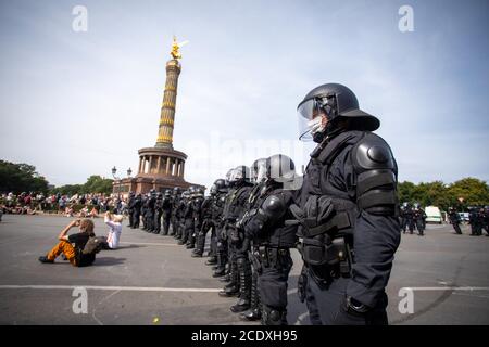 Berlin, Germany. 30th Aug, 2020. Police officers stand in front of the Victory Column in a protest against the Corona measures. Credit: Christoph Soeder/dpa/Alamy Live News Stock Photo