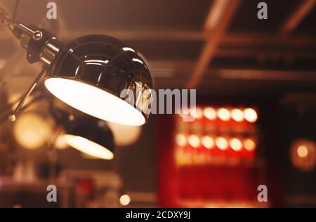 Modern glowing lamps in room Stock Photo