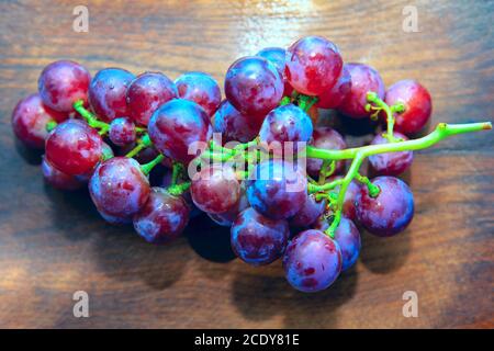 Tasty Grapes On Wooden Background Stock Photo