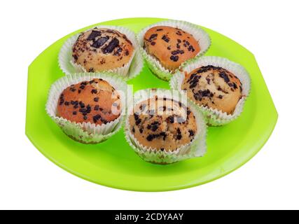 Homemade soft sweet  Easter  muffins with chocolate  on a green plate isolated Stock Photo