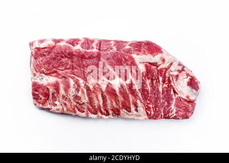 Raw veal spare loin ribs St Louis cut offered as top view on white background Stock Photo