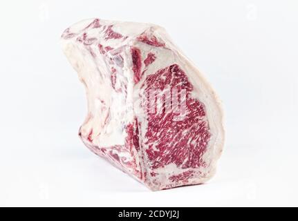 Raw dry aged wagyu cote de boeuf beef block as closeup on white background with copy space – free-from select Stock Photo