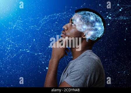 Thoughtful african american man watching stars, profile portrait Stock Photo
