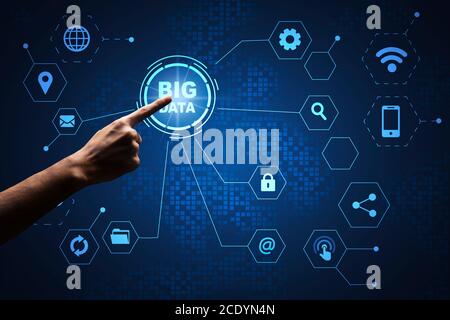 Man pressing Big data button on virtual screen with digital icons network Stock Photo