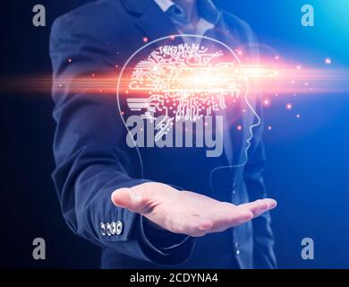 Innovative Technologies For Business. Businessman holding digital polygonal brain hologram on palm Stock Photo