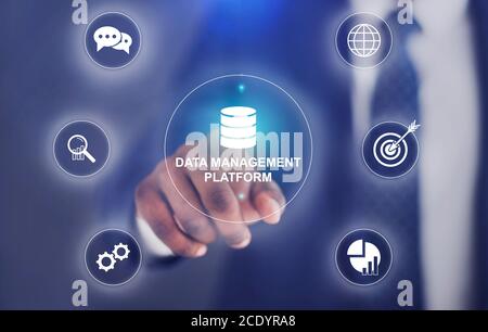 Data Management Platform. Black Businessman Touching Virtual Screen With Business Technology Infographic Stock Photo
