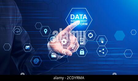 Data Management Platform. Businessman Pressing Button On Screen With Multimedia Icons, Collage Stock Photo