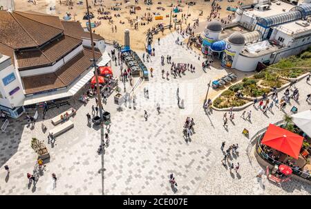 Bournemouth, UK. Sunday 30 August 2020. Bournemouth beach is busy on the August Bank Holiday weekend as people flock to the beach in the sunny weather. Seen from an aerial view. Credit: Thomas Faull/Alamy Live News Stock Photo