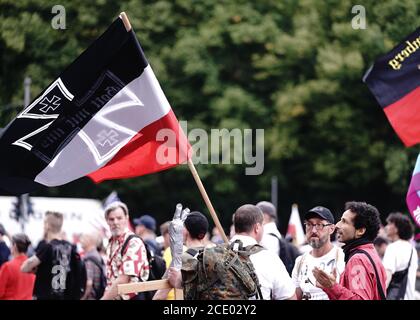 Berlin, Germany. 30th Aug, 2020. Participants demonstrate with an imperial war flag against the corona measures of the Federal Government in front of the Brandenburg Gate. Credit: Kay Nietfeld/dpa/Alamy Live News Stock Photo