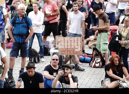 Berlin, Germany. 30th Aug, 2020. Participants demonstrate against the corona measures of the German government in front of the Brandenburg Gate. Credit: Kay Nietfeld/dpa/Alamy Live News Stock Photo