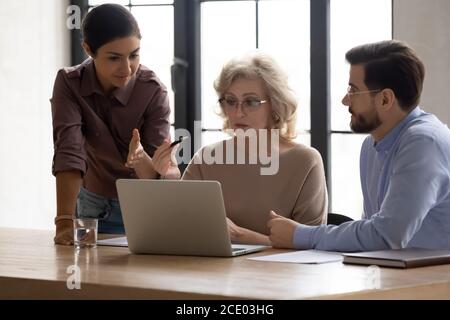Diverse employees developing company growth strategy in office. Stock Photo