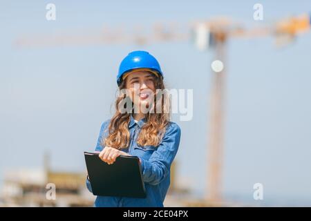 young woman engineer working in construction site Stock Photo