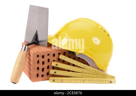 tools and brick as symbol for house construction Stock Photo