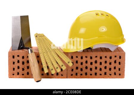 tools and brick as symbol for house construction Stock Photo