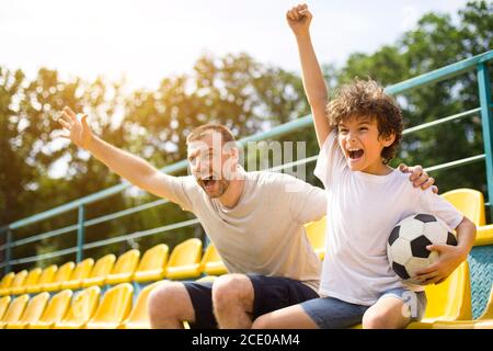 Victory. Excited, Happy Family Watch American Football Match, Championship  On The Couch At Home. Fans Emotional Cheering For Favourite National Team.  Daughter, Dad And Grandpa. Sport, TV, Having Fun. Stock Photo, Picture