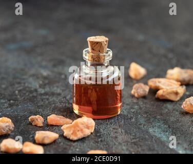 A bottle of styrax benzoin essential oil and resin Stock Photo