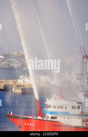 Fire fighting vessels to the water discharge training Stock Photo