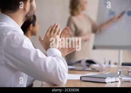 Close up happy young businessman clapping hands. Stock Photo
