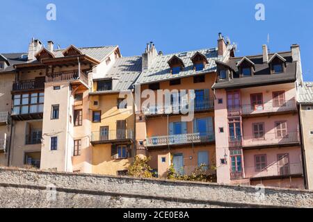 Narrow, tall, brightly painted houses in the Old Town of Briancon, Hautes-Alpes, France Stock Photo