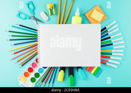 A set of school supplies for learning and creative development on a cyanide background. Stock Photo