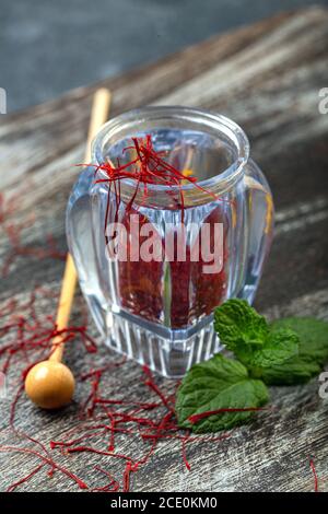 Saffron in a vial. Precious Oriental spice. Stock Photo