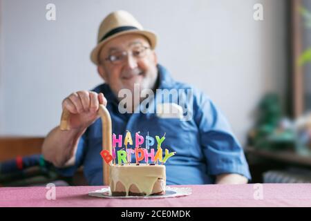 elderly man celebrating his birthday Stock Photo