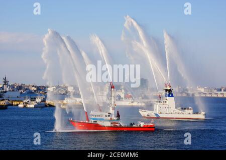 Fire fighting vessels to the water discharge training Stock Photo