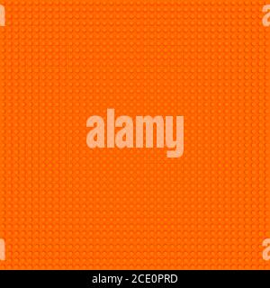 orange base template of plastic construction brick. Plastic toy blocks background in orange. Construction plate base for children's toys. Repeating te Stock Photo