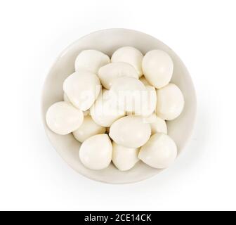 Fresh Mozzarella balls in white bowl isolated on white. Top view. Stock Photo