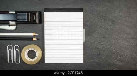 Top view of blank booklet and office or school accessories. Stock Photo