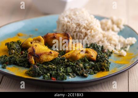 Indian murgh palak dish with rice Stock Photo