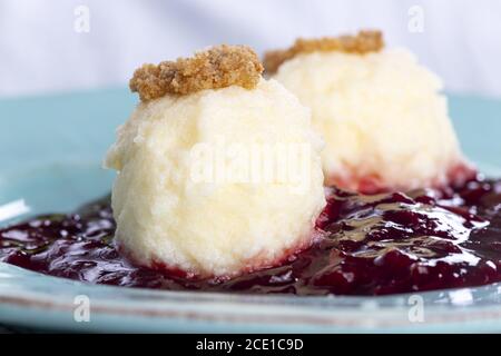 Austrian quark noodles on plum sauce Stock Photo