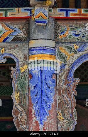 Detail-polychrome decoration-fine woodcarving-roof supporting column. Entrance porch Shengguo temple-Mati Si-Zhangye-Gansu-China-1024 Stock Photo