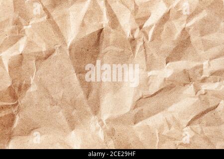 Crumpled ecological or kraft paper. Old paper surface texture. Stock Photo