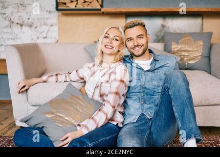 Young happy couple portrait relax and hugging at home Stock Photo