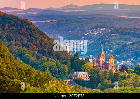 Drachenburg at twilight. Schloss Drachenburg is a private villa styled as a palace and constructed in the late 19th century. It was completed in only Stock Photo