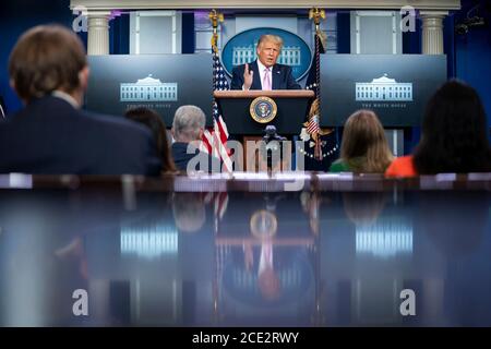 U.S. President Donald Trump holds a coronavirus update briefing for the media in the Press Room of the White House August 18, 2020 in Washington, DC. Stock Photo