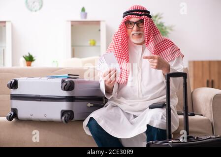 Old arab businessman preparaing for the business trip Stock Photo