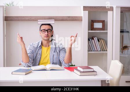 Male student preparing for exam at home Stock Photo