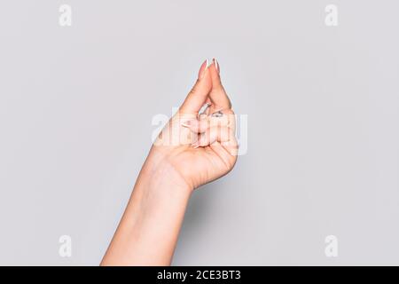 Hand of caucasian young woman snapping fingers for success, easy and click symbol gesture with hand Stock Photo