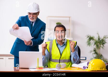 Two architects working in the office Stock Photo