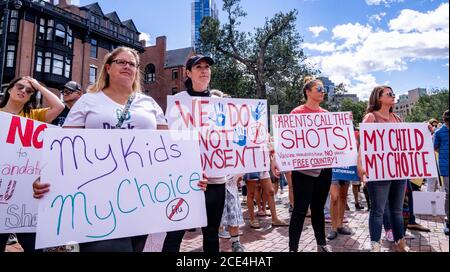 August 30, 2020, Boston, Massachusetts, USA:Protesters rally during anti flu shot mandate rally in Boston. Hundreds of the anti flu shot protesters rally against Massachusetts flu vaccine mandate outside of the Statehouse on August 30, 2020. Massachusetts public health officials announced on August 19 that influenza immunization were now required for all students over 6 months old at pre-school, K-12, and colleges unless either a medical or religious exemption is provided. Students will be expected to have received a flu vaccine by December 31, 2020, for the 2020-2021 flu season. (Photo by Ke Stock Photo